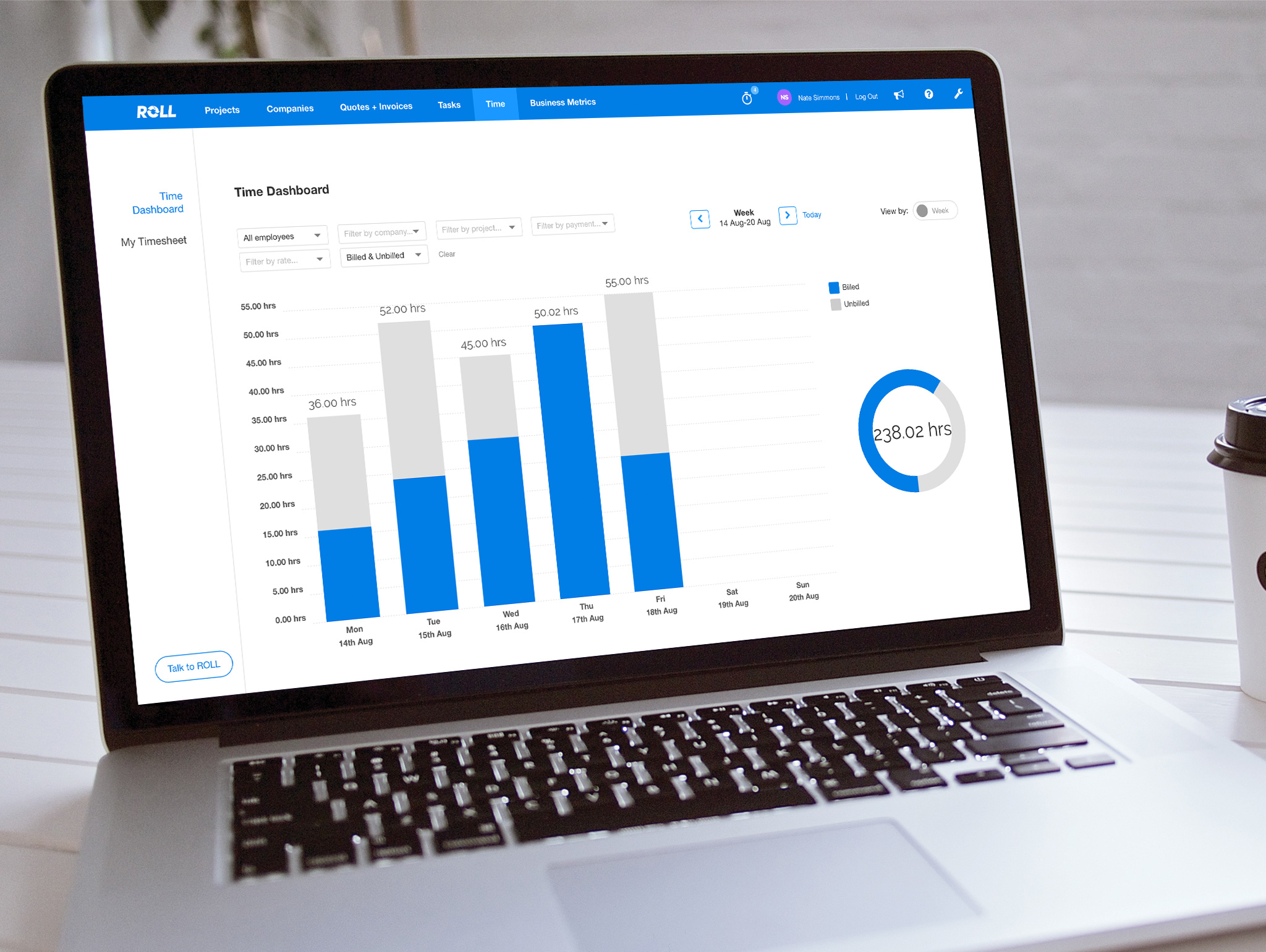 ROLL software's time reporting dashboard on a laptop screen